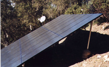 A solar panel sitting on top of a roof.